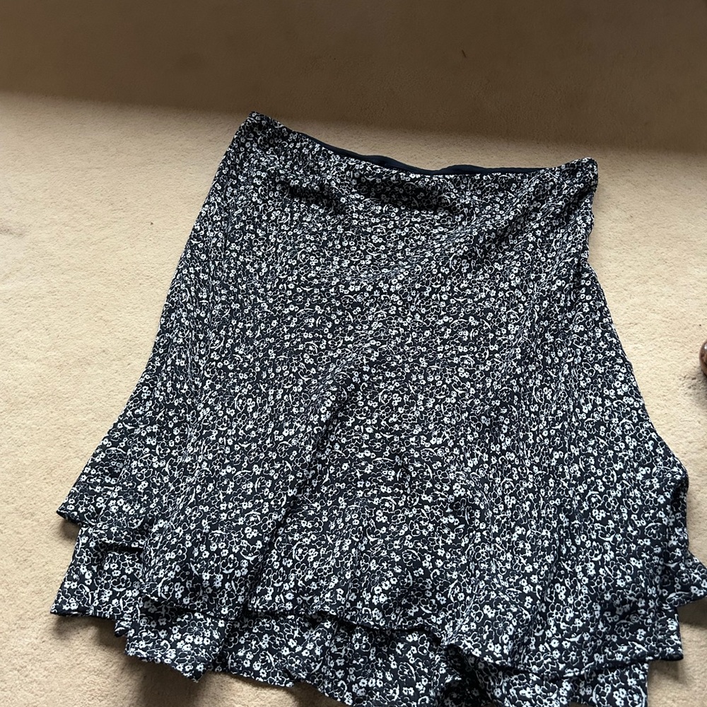 Chaps skirt lined with layered hem. Small floral pattern
